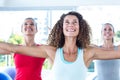 Fit women looking up and smiling with arms outstretched Royalty Free Stock Photo