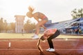 Fit women at the stadium playing leap frog. Royalty Free Stock Photo