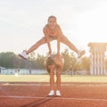 Fit women at the stadium playing leap frog. Royalty Free Stock Photo