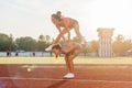 Fit women at the stadium playing leap frog. Royalty Free Stock Photo