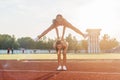 Fit women at the stadium playing leap frog. Royalty Free Stock Photo