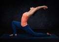 Fit yogini woman practices yoga asana Royalty Free Stock Photo