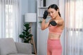 Fit young asian woman portrait in sportswear and home workout. Vigorous