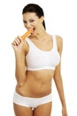 Fit young beautiful woman with carrot