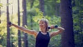 Fit young blonde woman working out with dumbbells outside Royalty Free Stock Photo