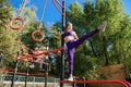 Fit young female doing pull ups exercises on crossbar outdoors. Sport and healthy lifestyle concept Royalty Free Stock Photo