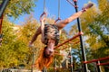 Fit young female doing pull ups exercises on crossbar outdoors. Sport and healthy lifestyle concept Royalty Free Stock Photo