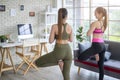 Fit young friend women doing yoga and meditation at home, sport and healthy lifestyle concept Royalty Free Stock Photo