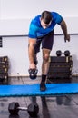 Fit young man doing kettle bell exercise at the gym Royalty Free Stock Photo