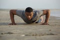 Fit young man doing push ups outdoors Royalty Free Stock Photo
