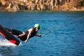 Pushing my limits. Fit young wakeboarder twisting, as he boardslides, while performing a trick - copyspace. Royalty Free Stock Photo