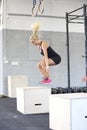 Fit young woman box jumping at the fitness gym Royalty Free Stock Photo