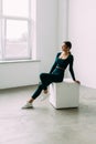 Fit young woman doing box jump exercise. Muscular woman doing box jumps at gym Royalty Free Stock Photo