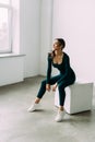 Fit young woman doing box jump exercise. Muscular woman doing box jumps at gym Royalty Free Stock Photo