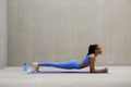 Fit young woman doing push ups at gym. Healthy young female working out on exercise mat. Royalty Free Stock Photo