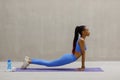 Fit young woman doing push ups at gym. Healthy young female working out on exercise mat. Royalty Free Stock Photo