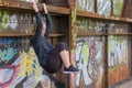 Fit young woman doing a workout on a metal girder