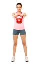 Fit Young Woman Lifting Kittle Bell