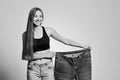 Fit young woman in loose jeans Royalty Free Stock Photo