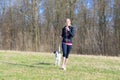 Fit young woman out jogging with her dog Royalty Free Stock Photo