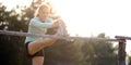 Fit young woman stretches muscles after jogging, running and exercising outdoors in nature Royalty Free Stock Photo