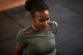 Fit young woman sweating while sitting in a gym Royalty Free Stock Photo