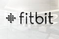 Fitbit on glossy office wall realistic texture