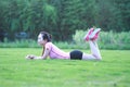 Fitness Asian Chinese woman have a rest at grass in a park Royalty Free Stock Photo