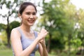 Fitness Asian Girl in tight sportswear doing exercises and punching boxing footwork cardio exercise in park. Female student boxer