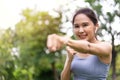 Fitness Asian Girl in tight sportswear doing exercises and punching boxing footwork cardio exercise in park. Female student boxer