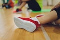 Fitness athletes foot close-up. Healthy lifestyle and sport concepts. Woman in fashionable sportswear is doing exercise. Royalty Free Stock Photo