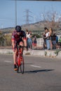 Fitness athletes pedaling their bikes during a national Triathlon, swimming, cycling and running events.