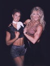 Fitness Athletes Rachel Riker & Debbie Kruck Compare Biceps at NJ Show in 1998 Royalty Free Stock Photo