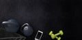 Fitness background with kettlebells and smartphone.