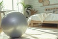 fitness ball used for leg lifts, serene bedroom environment