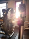 Fitness barbell against the sunlight with lensflare.