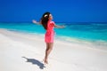 Fitness. Beautiful happy woman jumping on exotic sea, brunette s Royalty Free Stock Photo