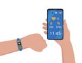 Fitness bracelet connected to mobile phone. Smartband on hand and smartphone application showing indicators of pulse, steps and