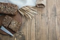 Fitness bread. A loaf of fresh rustic whole meal rye bread, sliced on a wooden board, rural food background. Copy space. Royalty Free Stock Photo