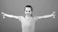 Fitness child. Portrait of sporty little girl with dumbbells over yellow studio isolated background. Gym workout. Child Royalty Free Stock Photo