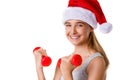 Fitness christmas young girl training lifting hand weight wearing santa hat,isolated Royalty Free Stock Photo