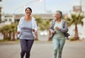 Fitness, city or friends running in a marathon challenge with sports performance goals on urban city street. Happy Royalty Free Stock Photo