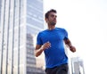 Fitness, city and male athlete running for health, wellness or training for a marathon, competition or race. Sports