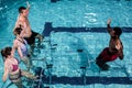 Fitness class doing aqua aerobics on exercise bikes Royalty Free Stock Photo