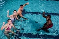 Fitness class doing aqua aerobics on exercise bikes Royalty Free Stock Photo