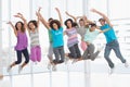 Fitness class jumping in fitness studio Royalty Free Stock Photo