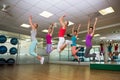 Fitness class jumping up in studio Royalty Free Stock Photo