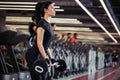 Fitness, close up of young woman pick up for biceps in gym Royalty Free Stock Photo