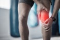 Fitness, closeup and man with a knee injury, accident or pain after a exercise in the gym. Sports, medical emergency and