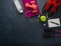 Sneakers dumbbells bottle of water apple and skipping rope Royalty Free Stock Photo